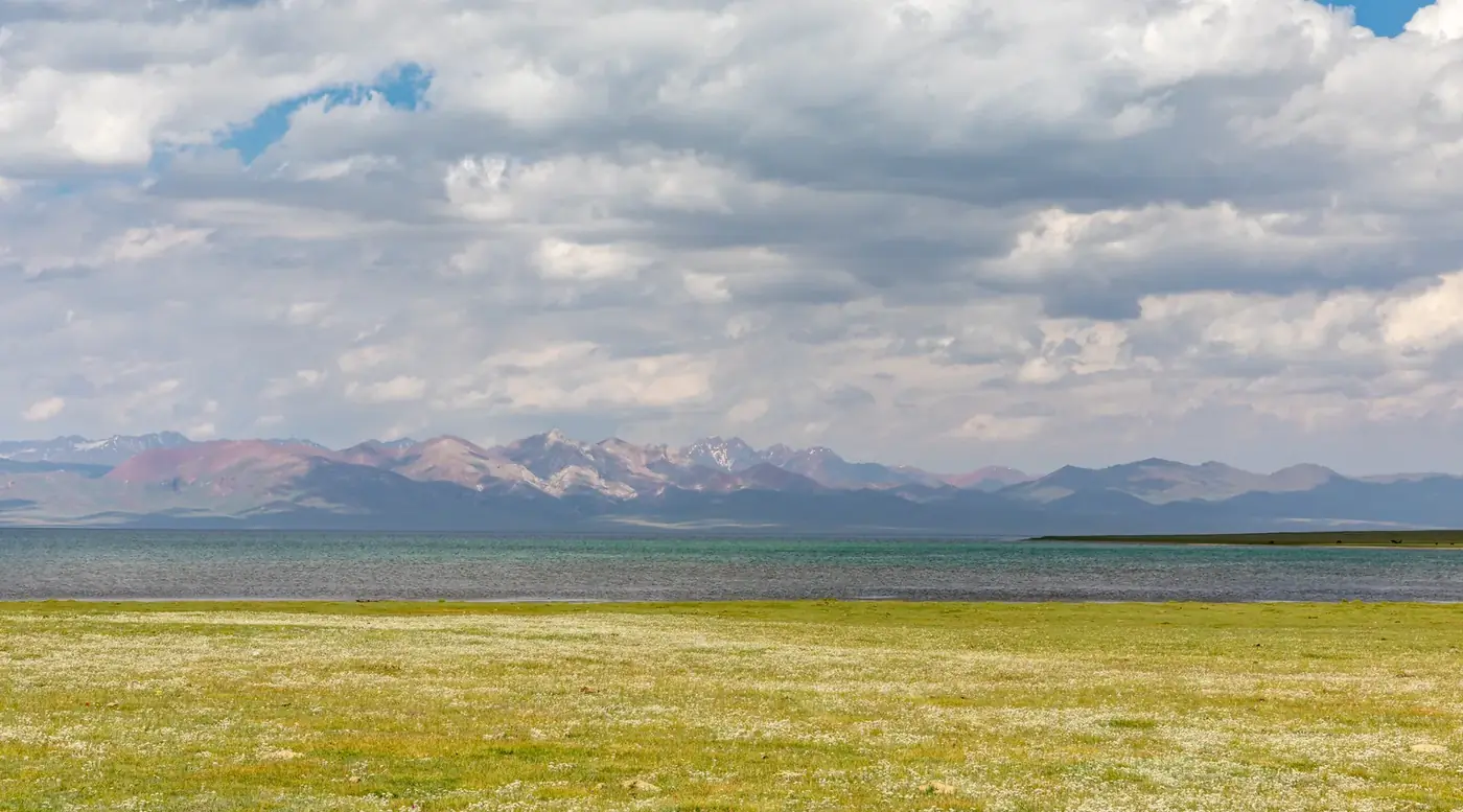 Yurt camp on the shores of Song-Kul lake at dusk